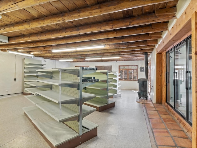 basement featuring wooden ceiling and tile patterned floors