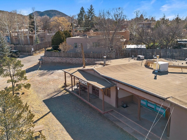 exterior space featuring fence and a mountain view