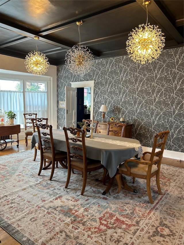 dining room featuring coffered ceiling, a chandelier, hardwood / wood-style flooring, and beamed ceiling