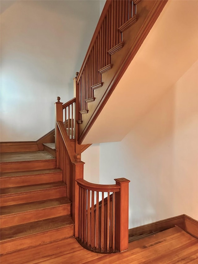 staircase featuring hardwood / wood-style floors