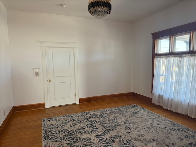 unfurnished room featuring hardwood / wood-style flooring