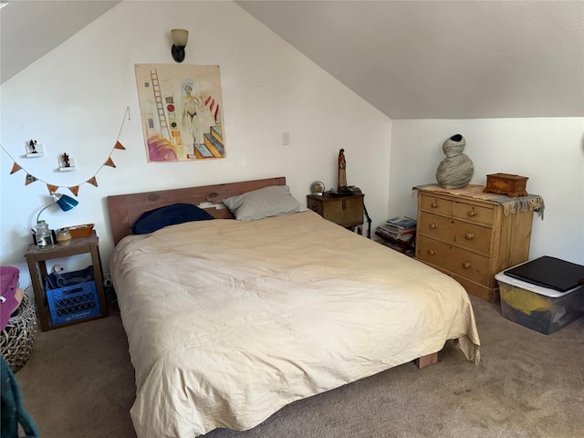 bedroom featuring lofted ceiling and carpet flooring