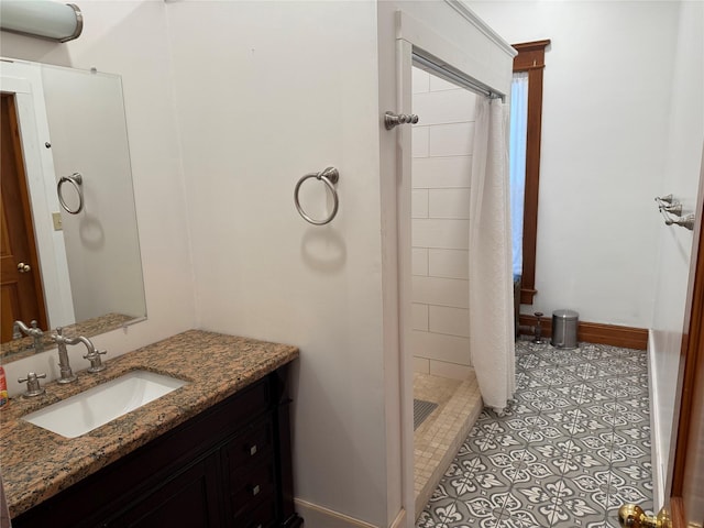 bathroom featuring vanity and a tile shower