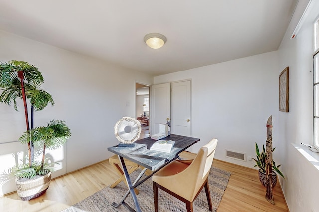 dining space with light wood-type flooring