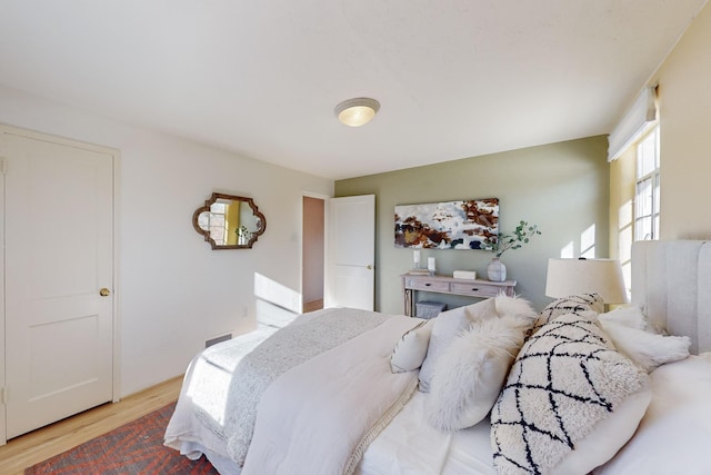 bedroom with light wood-type flooring