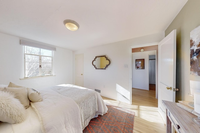 bedroom with light hardwood / wood-style floors