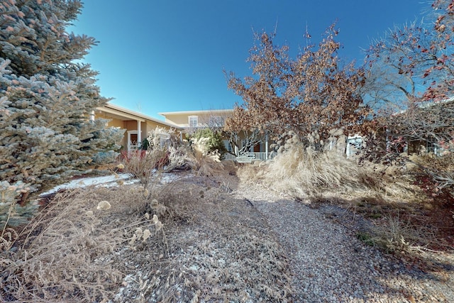 view of property hidden behind natural elements