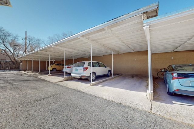 view of vehicle parking featuring a carport