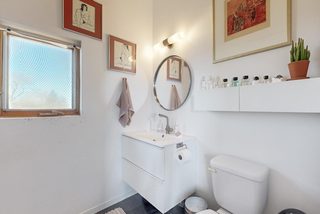 bathroom with toilet and vanity