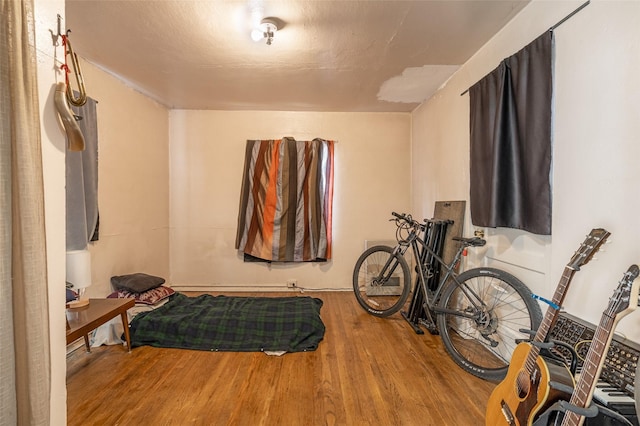 bedroom with hardwood / wood-style flooring