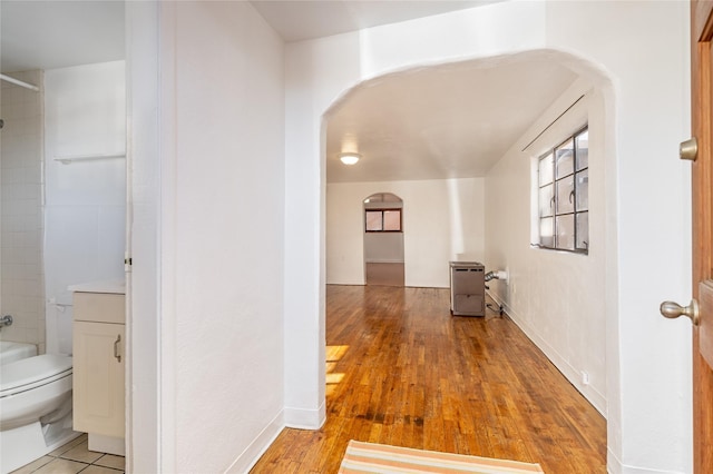 hall with light hardwood / wood-style floors