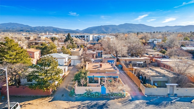 birds eye view of property with a mountain view