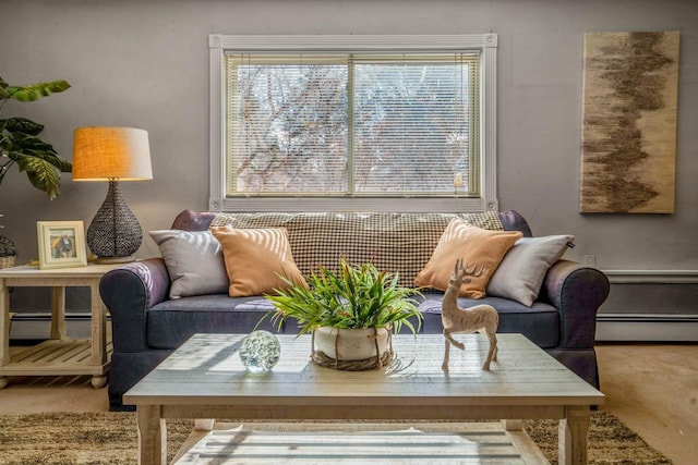 carpeted living room with a baseboard radiator