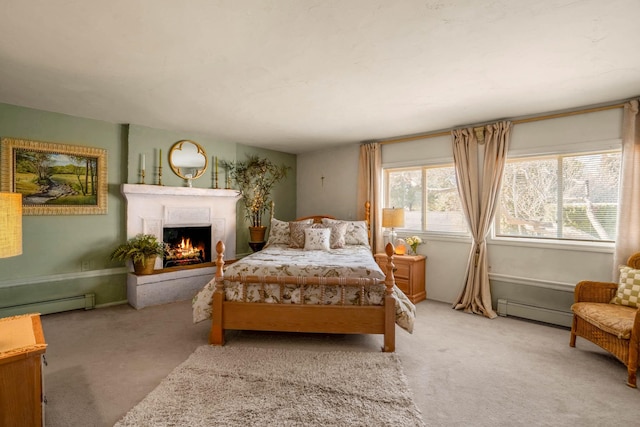 carpeted bedroom featuring a baseboard radiator