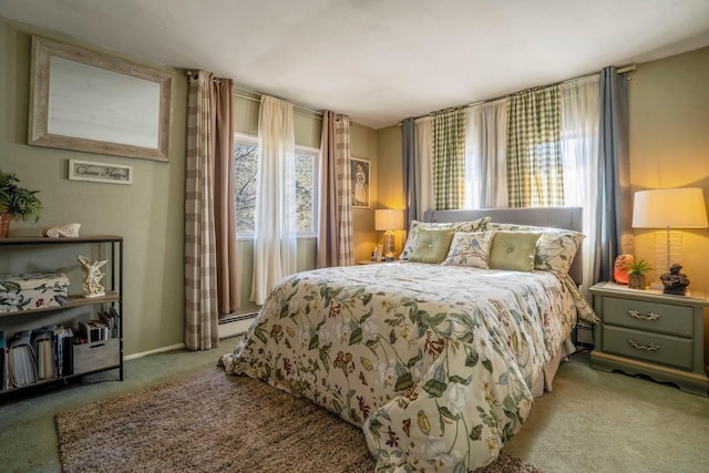 carpeted bedroom featuring baseboard heating