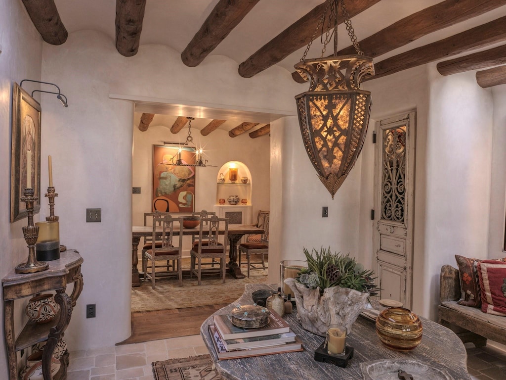 dining room featuring brick ceiling and a notable chandelier