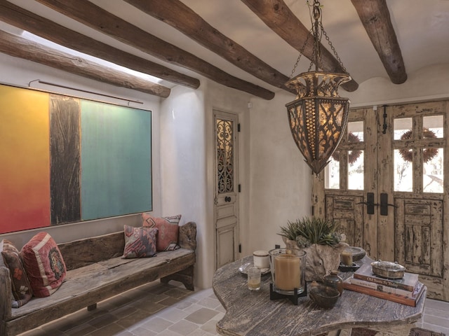 living room featuring beamed ceiling