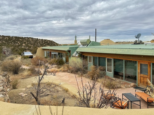 back of property featuring a patio area