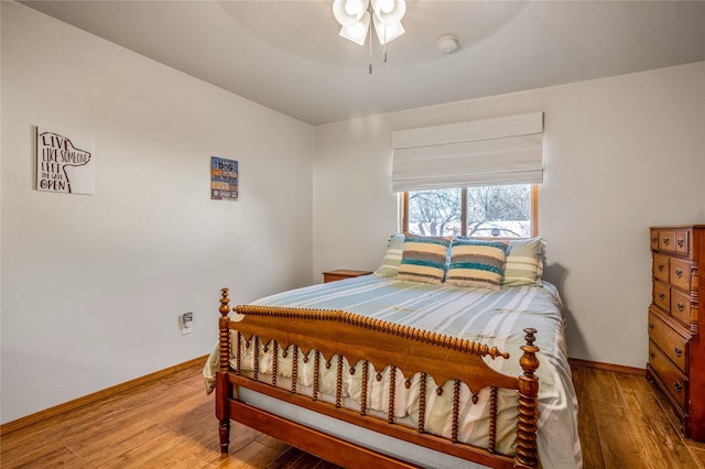 bedroom featuring ceiling fan and hardwood / wood-style flooring