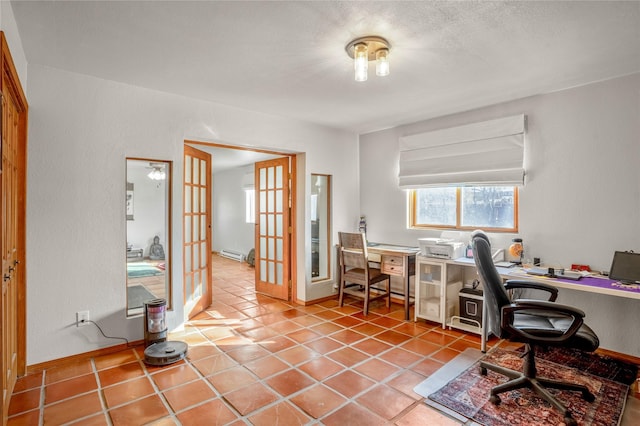 office featuring baseboard heating, light tile patterned floors, and french doors