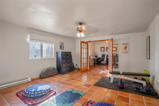 interior space featuring a textured ceiling, baseboard heating, french doors, and ceiling fan