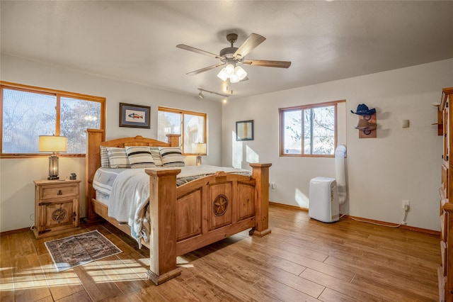 bedroom featuring ceiling fan and wood-type flooring