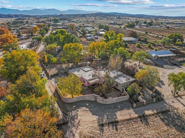 birds eye view of property featuring a mountain view