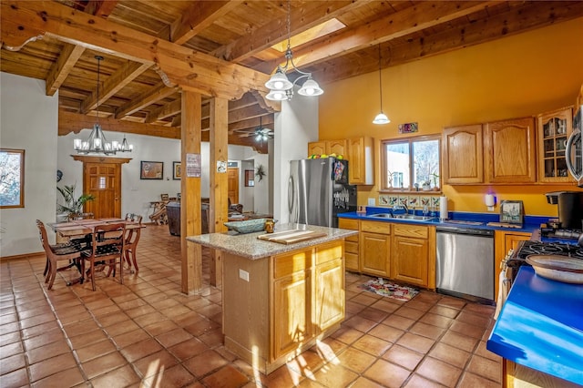 kitchen with a center island, wood ceiling, stainless steel appliances, beamed ceiling, and hanging light fixtures