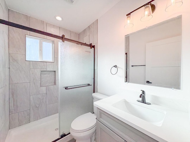1268 Maez Rd, Santa Fe, NM 87505 - full bathroom featuring toilet, a stall shower, recessed lighting, and vanity