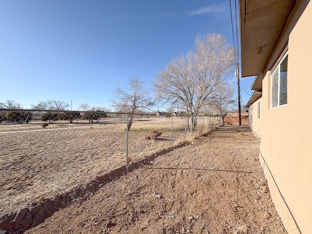 view of yard with a rural view