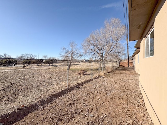 1268 Maez Rd, Santa Fe, NM 87505 - view of yard featuring fence and a rural view