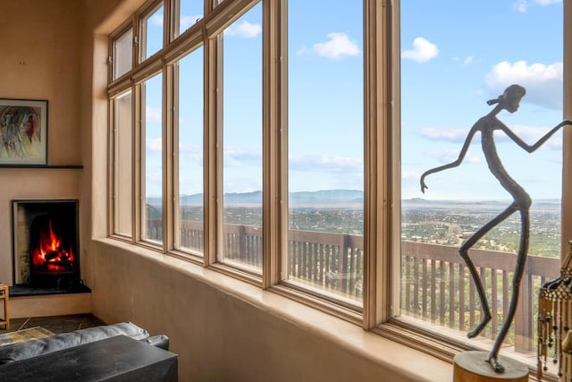 sunroom featuring a mountain view