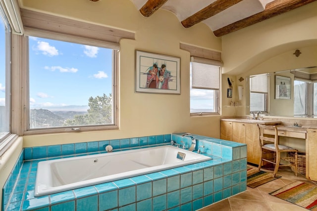 bathroom with a mountain view, a relaxing tiled tub, a wealth of natural light, and tile patterned flooring