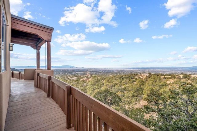 wooden terrace featuring a mountain view