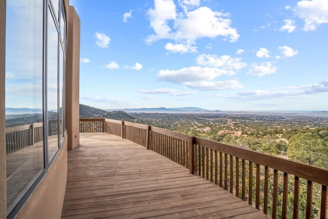 wooden deck featuring a mountain view