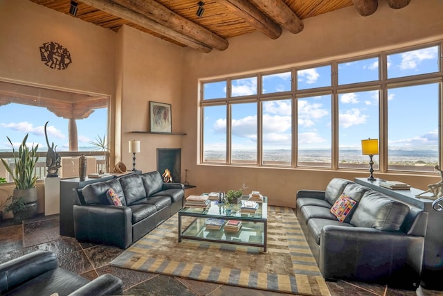 living room with wood ceiling and beam ceiling