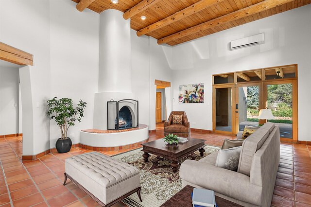 tiled living room with an AC wall unit, a high ceiling, wood ceiling, beamed ceiling, and a large fireplace