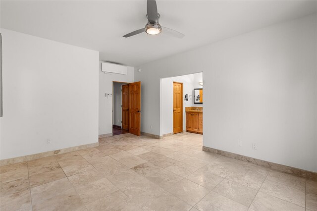 tiled empty room featuring ceiling fan