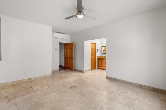 spare room with a wall mounted AC and ceiling fan