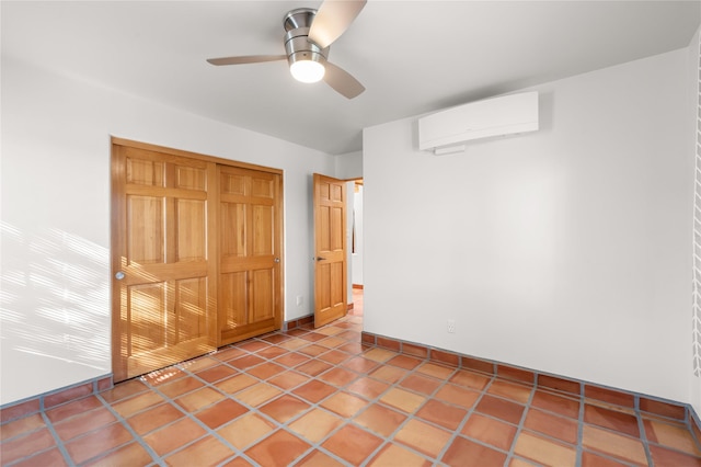 interior space with a wall mounted AC and ceiling fan