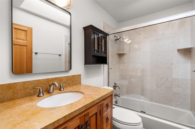 full bathroom featuring enclosed tub / shower combo, vanity, and toilet