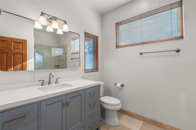 bathroom with vanity, toilet, an enclosed shower, and tile patterned flooring