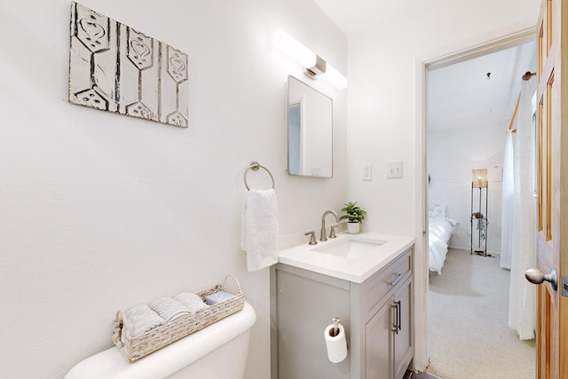 bathroom with vanity and toilet