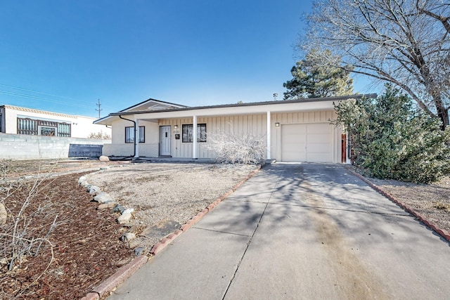 ranch-style home featuring a garage