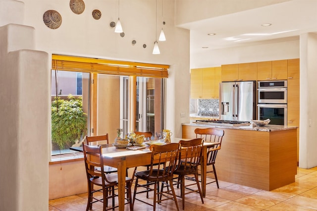 dining space with light tile patterned flooring