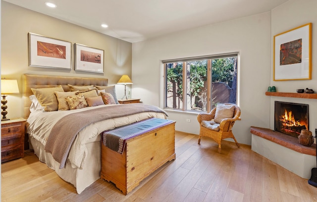 bedroom with light hardwood / wood-style flooring