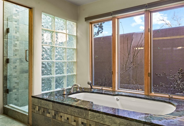 bathroom featuring tiled bath