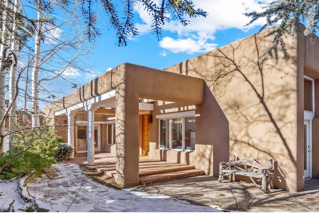 back of house with a patio