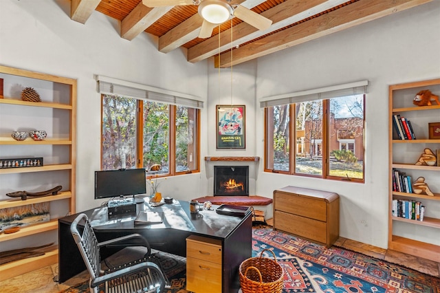 home office with beam ceiling, wooden ceiling, and ceiling fan