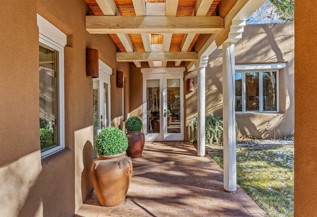 entrance to property with a patio and french doors